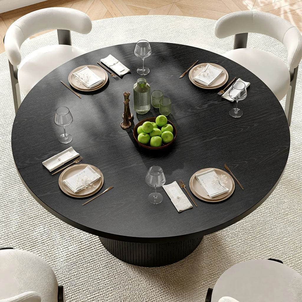 Overhead view of the Duskwhisper black round tabletop with wood-grain pattern, styled with four place settings.