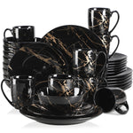 Load image into Gallery viewer, Elegant black dinnerware set with gold splatter design, modern luxury tableware for formal dining and special occasions

