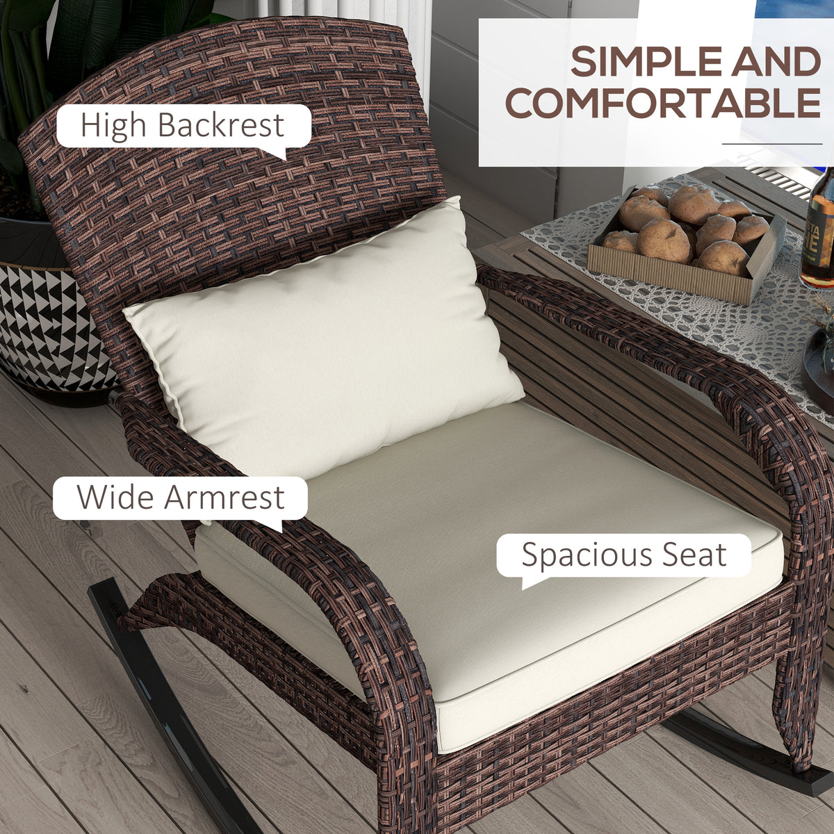 High-angle chair detail highlighting the tall woven back, wide curved arms and cream cushioned seat.