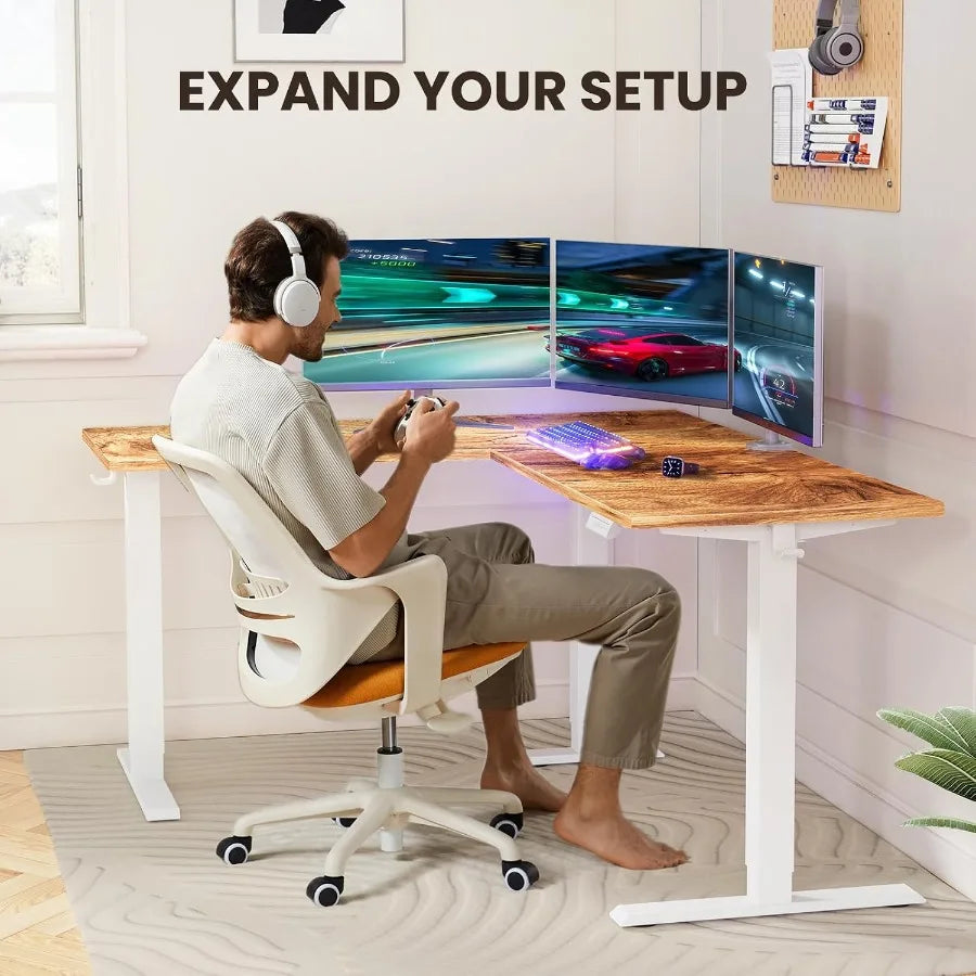 Seated gaming scene showing the desk’s wraparound work surface and under-desk hooks.