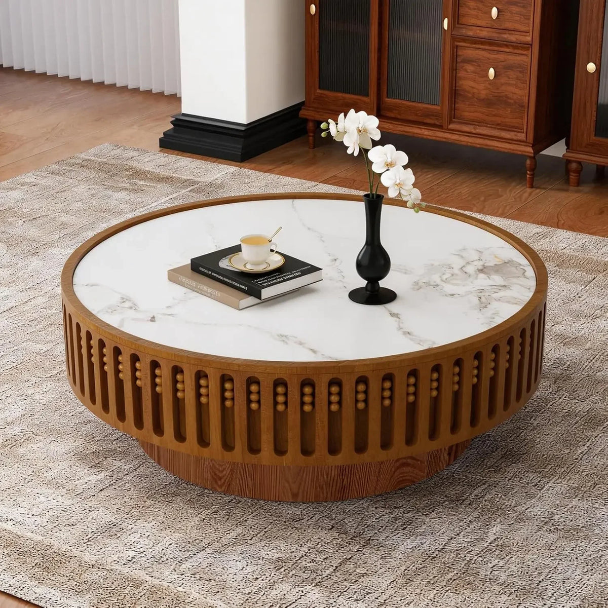 Orelia 35.4-inch coffee table with gray-veined white top and recessed beaded detailing around the base
