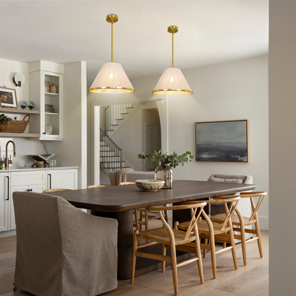 Loomveil woven-shade pendants shown above a wood dining table.