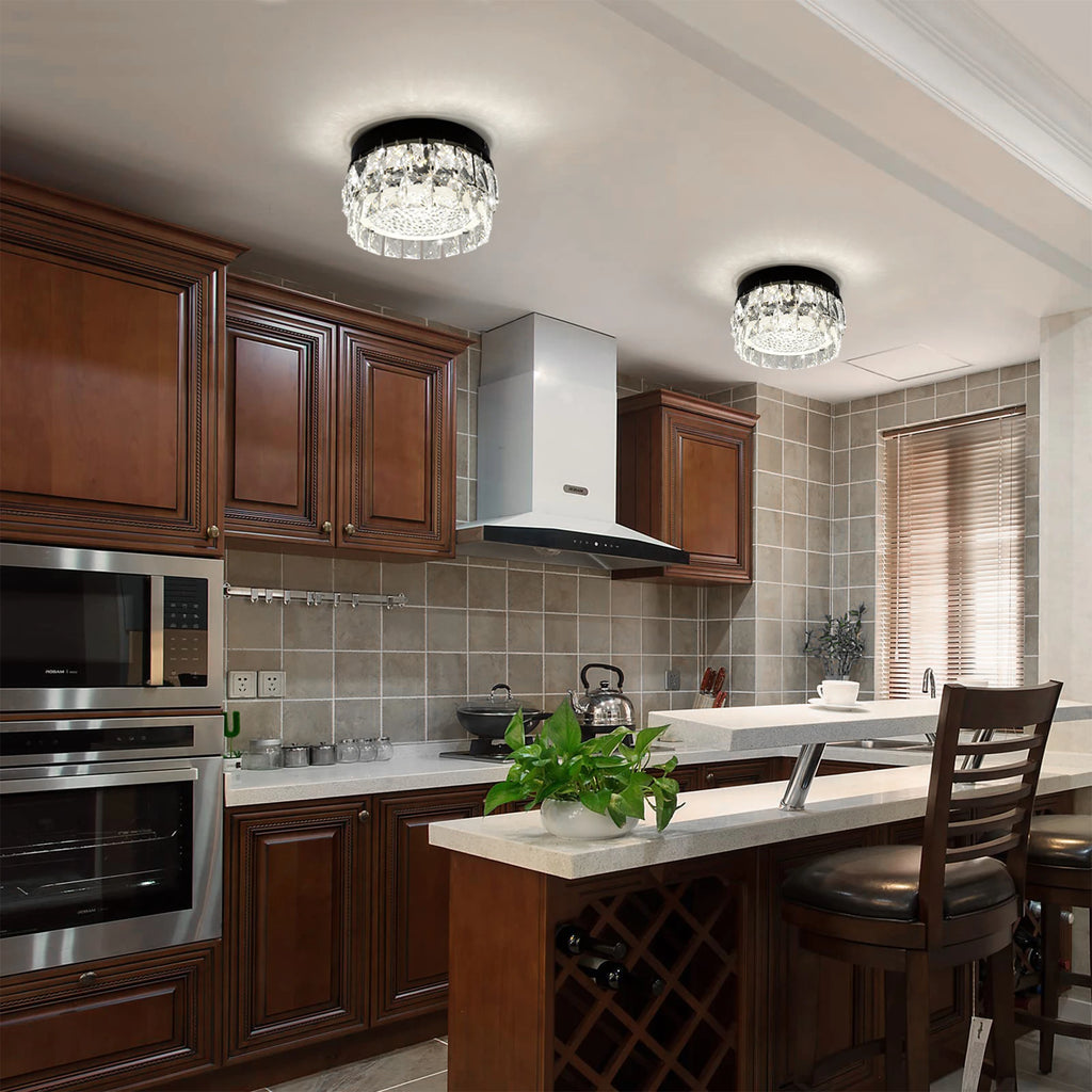 Glacielle: Two round crystal lights shown above a kitchen