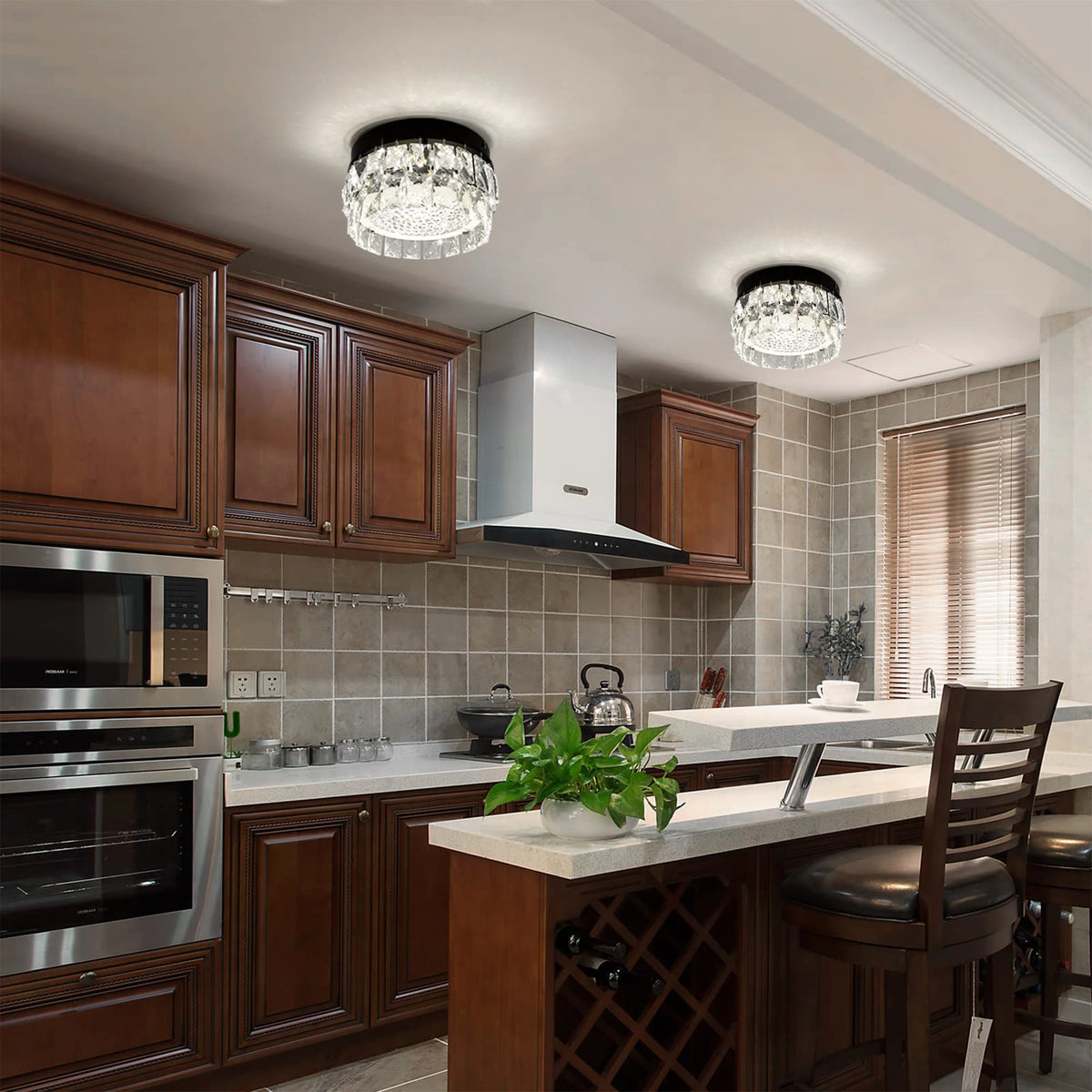 Glacielle: Two round crystal lights shown above a kitchen