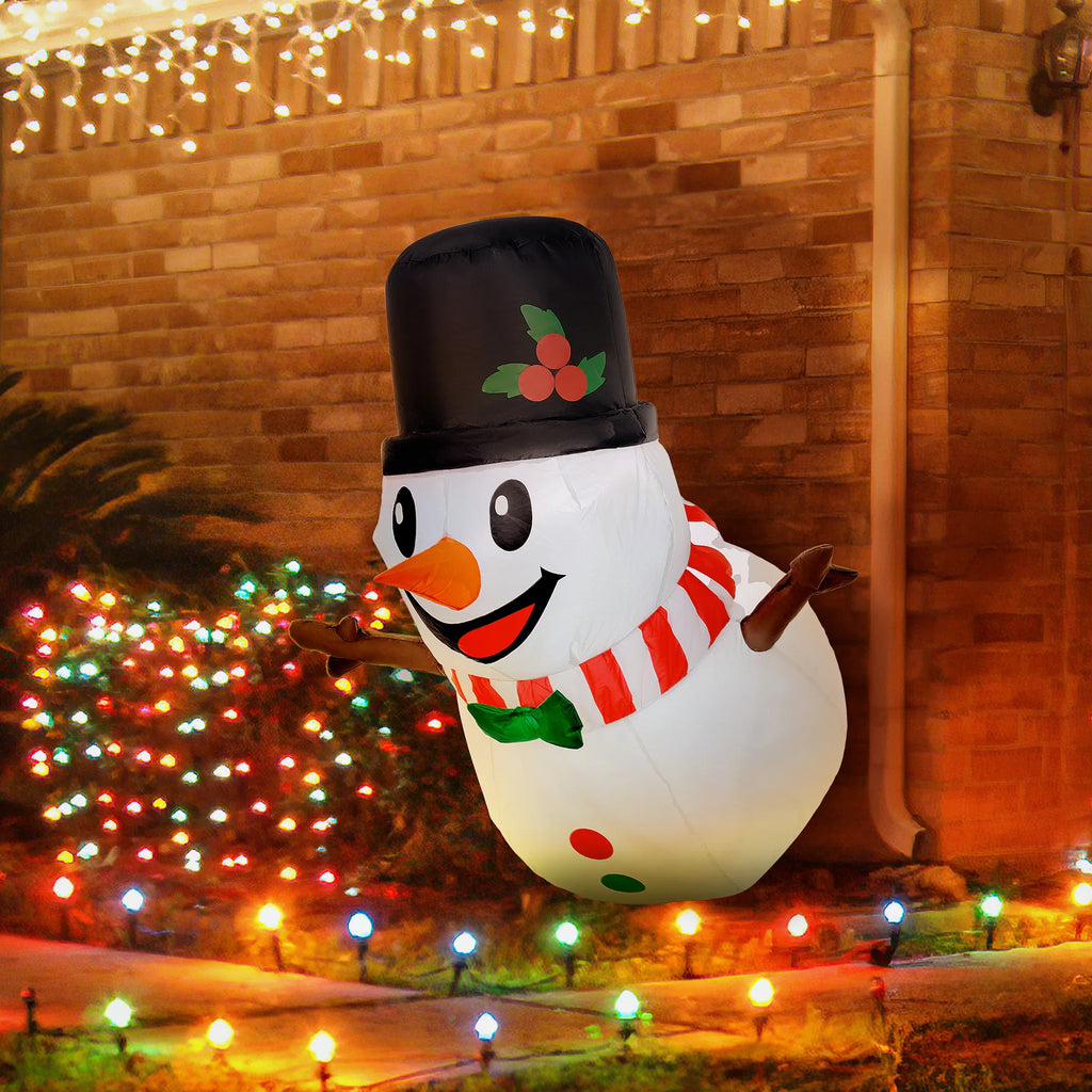 Snowperch hanging snowman illuminated in a festive outdoor display