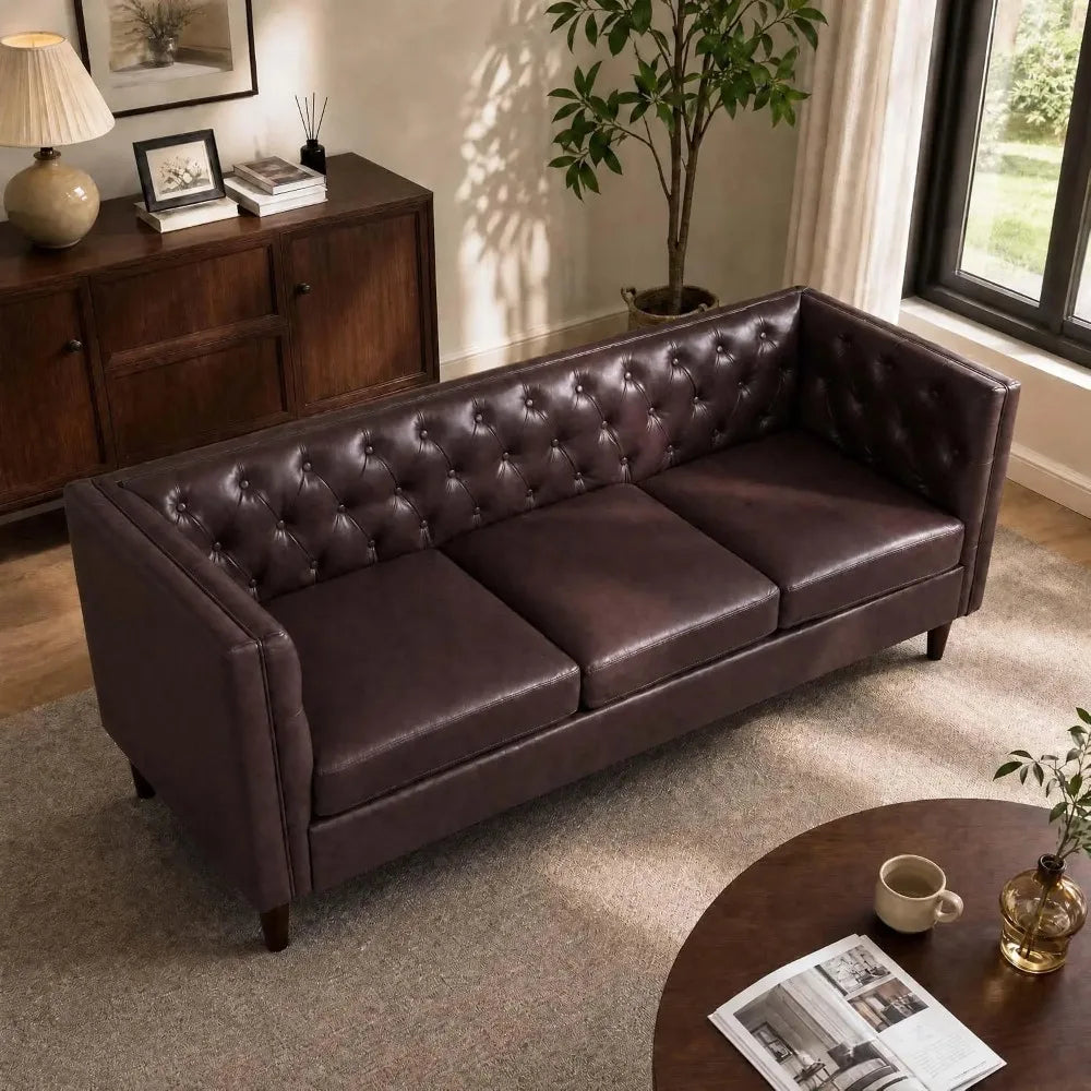 Fennwick brown tufted faux-leather couch shown in view from above