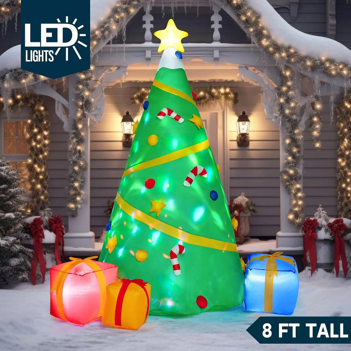 Starwhirl eight-foot green Christmas tree inflatable with colorful projection lighting and attached gift boxes.