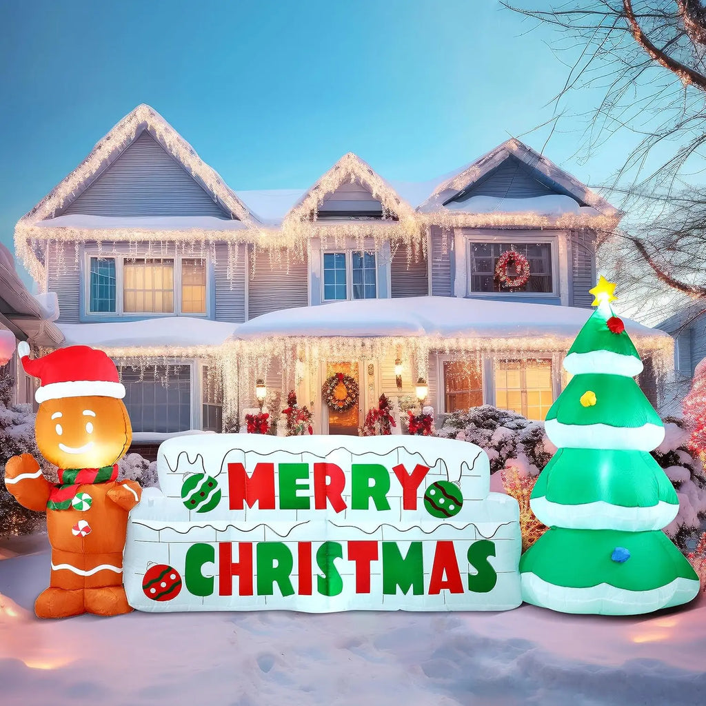 Gingerwish Merry Christmas inflatable sign with one gingerbread figure and one decorated tree.