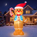 Pepperbow gingerbread inflatable holding a candy cane and wearing a blue vest, red bow tie and Santa hat.
