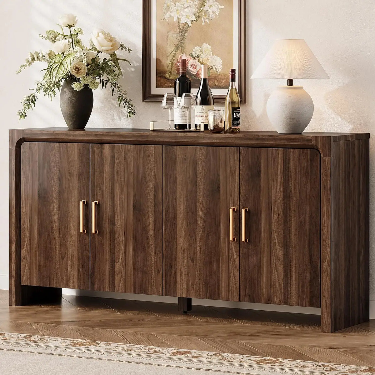 Cloudlark walnut-look sideboard staged with flowers, bottles and a table lamp