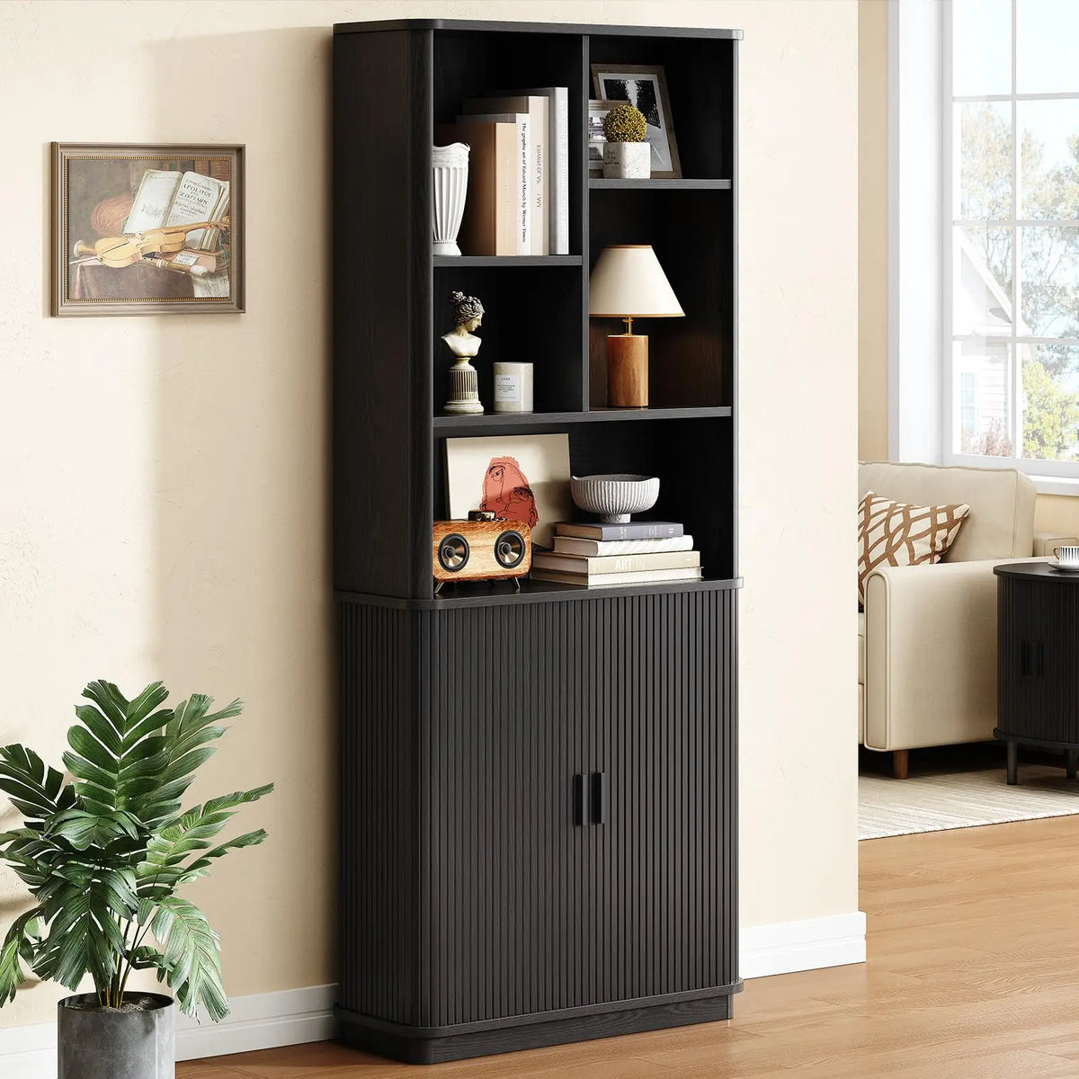 Black Hushbloom bookcase with divided open shelves and a fluted sliding-door lower cabinet