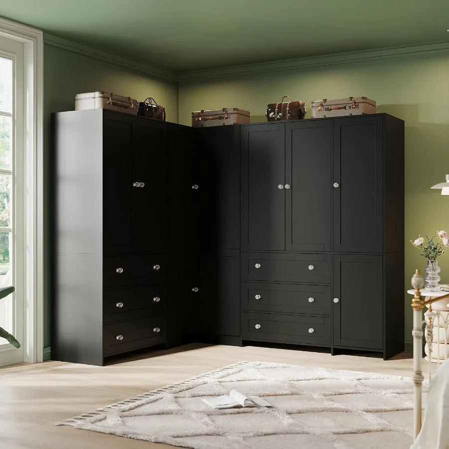 Coordinated black cabinet arrangement with a corner wardrobe between additional drawer cabinets.
