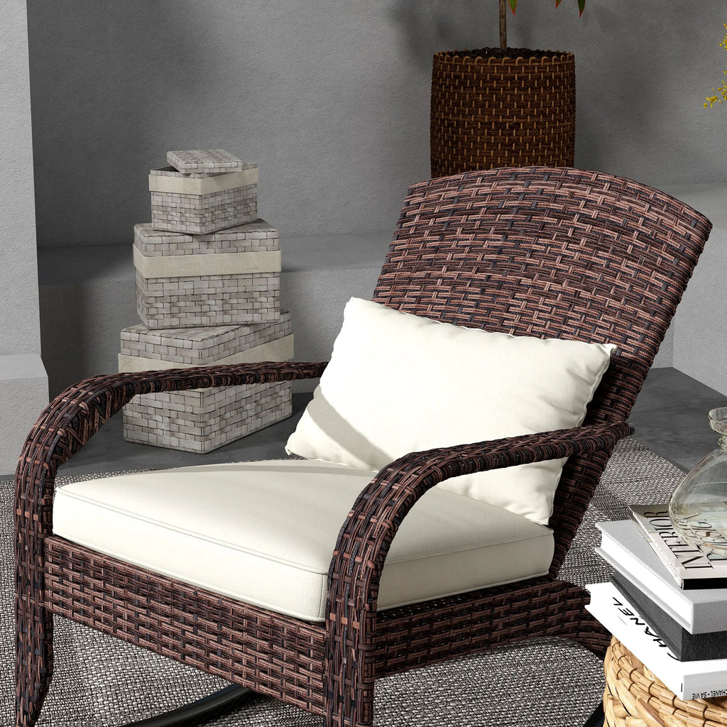 Close-up of the brown woven chair back and rounded arms with a cream seat cushion and rectangular pillow.