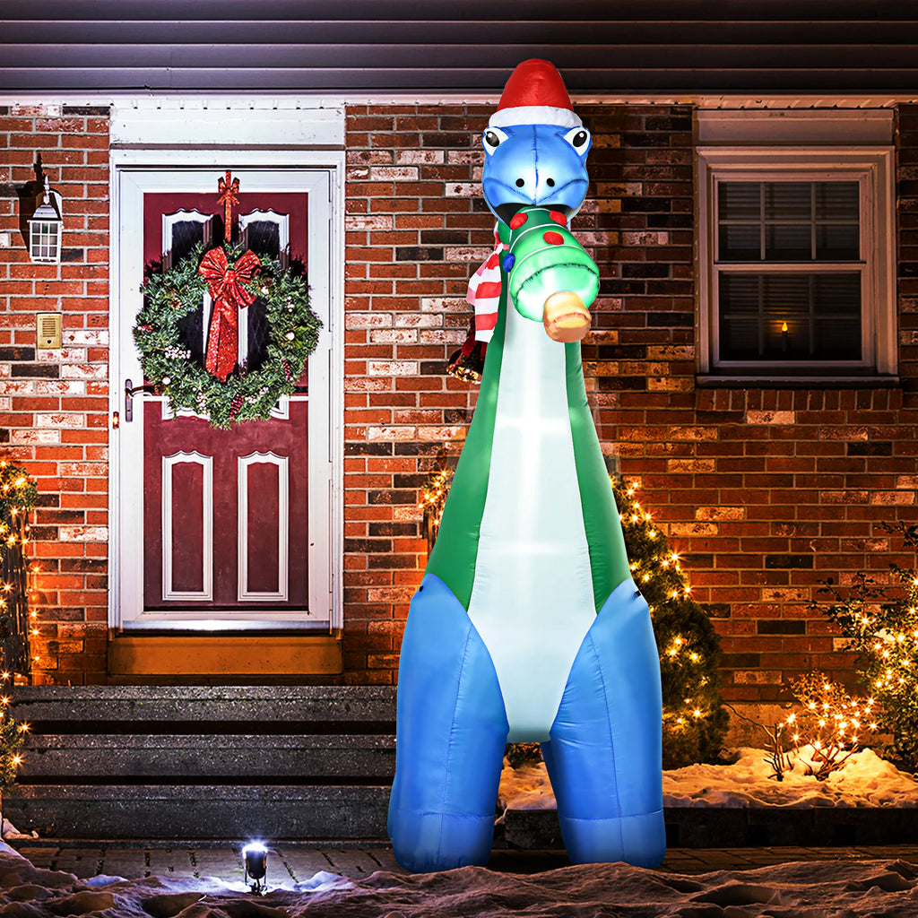 Merrysaurus blue-and-green Christmas dinosaur inflatable lit outside a holiday entrance