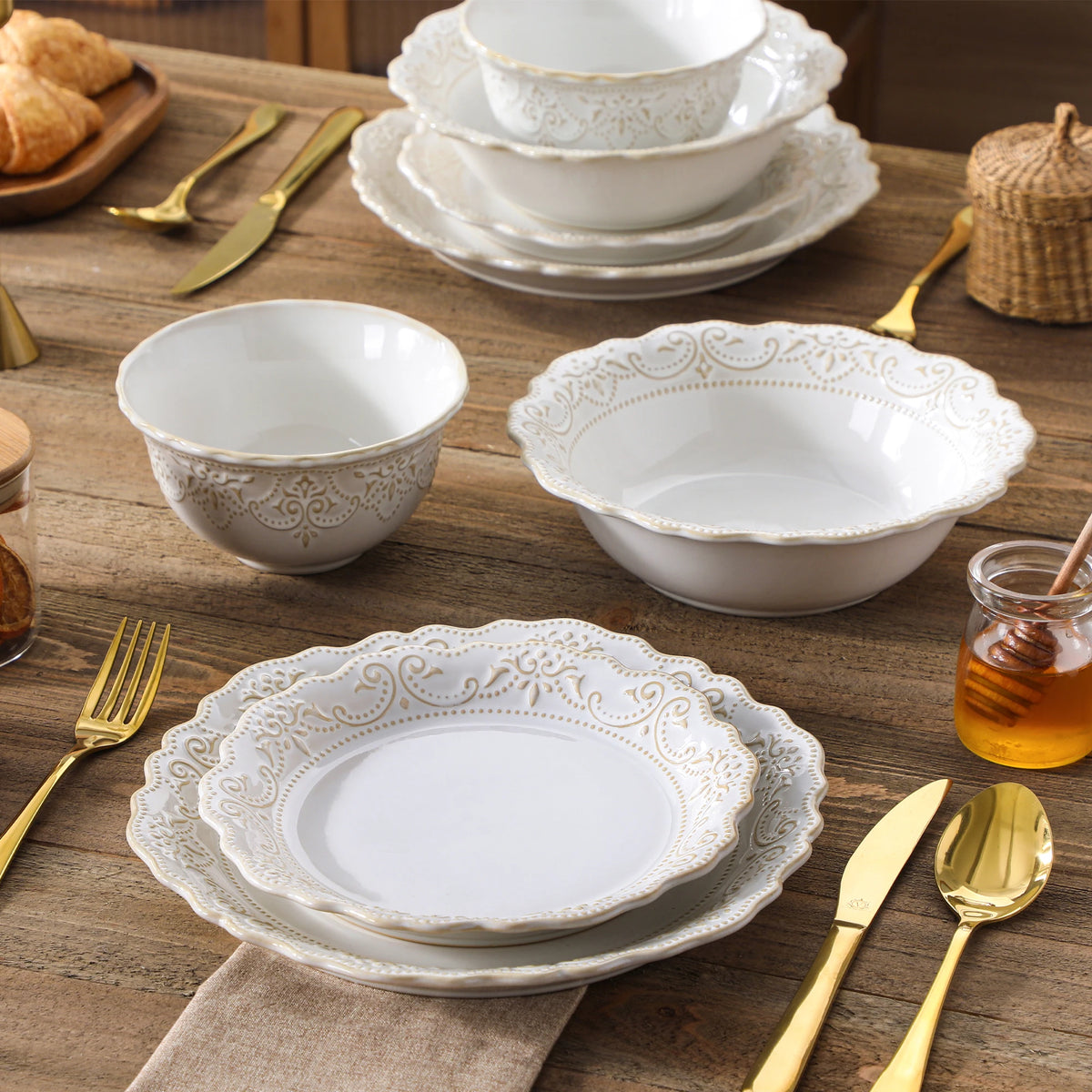 Close-up of matching relief plates, cereal bowl and wide soup bowl