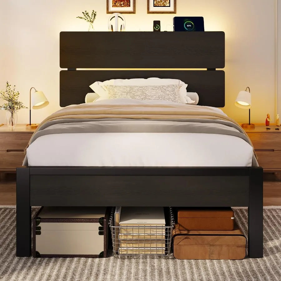 Black bed front view with warm headboard lighting and staged storage bins