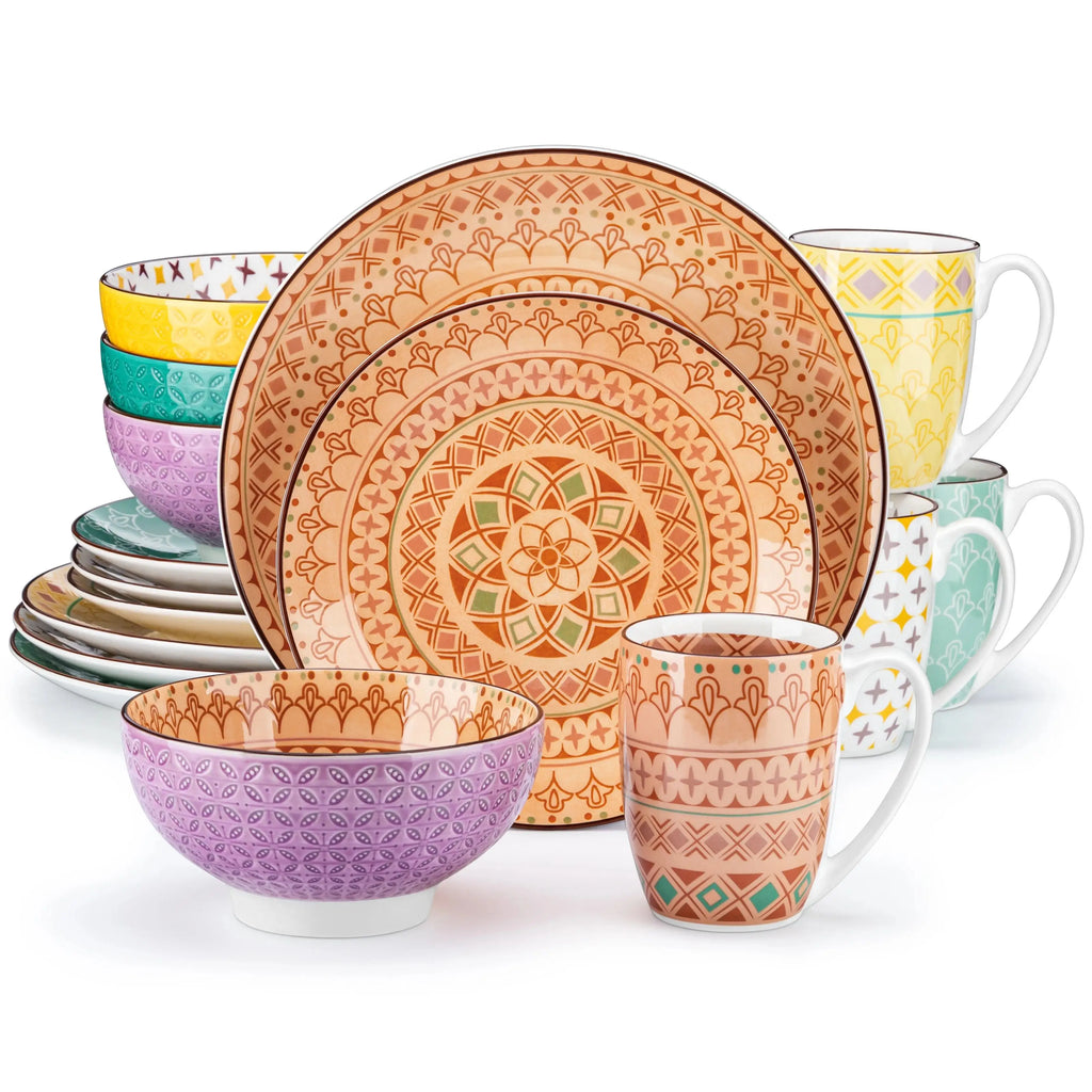 Colorful ceramic dinnerware set with geometric patterns on a white background