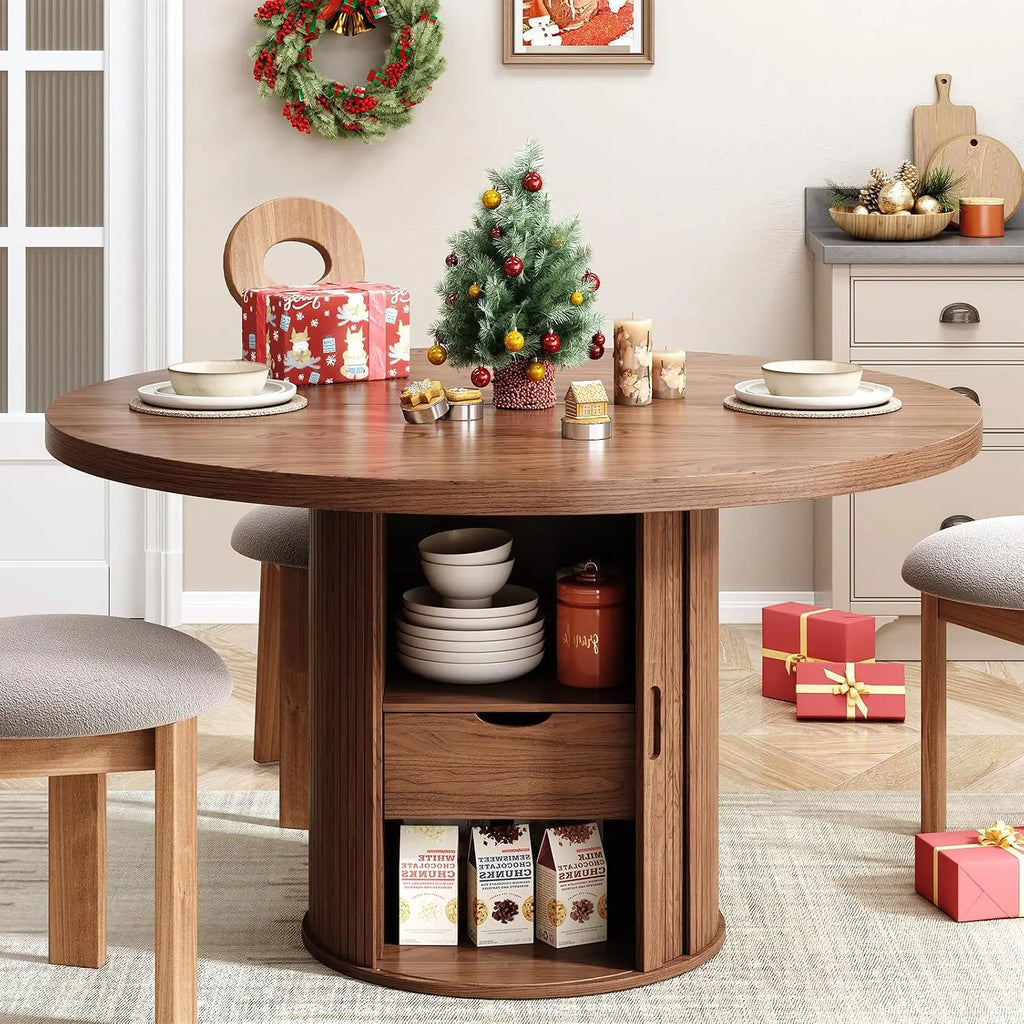 Rhymelark round walnut-look dining table with open pedestal storage in a holiday setting