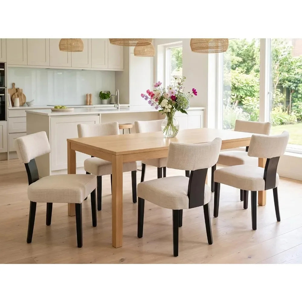 Sevrin set of six beige linen dining chairs styled around a rectangular table