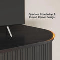 Close-up of the rounded countertop and fluted door on the Black Doveveil TV stand.