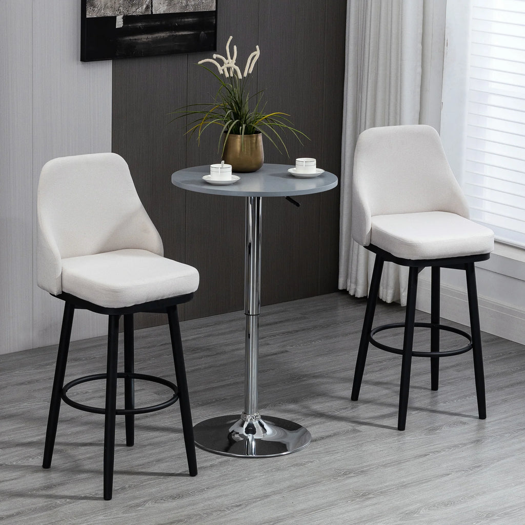 Pair of cream-white Softcrest swivel bar stools with black steel legs and circular footrests.