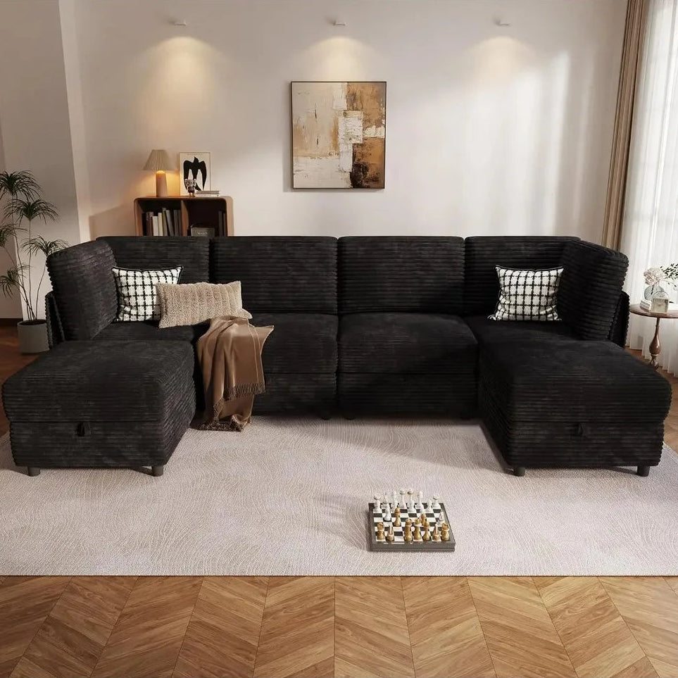 Sylvellen black U-shaped sectional with matching front ottomans in a living room