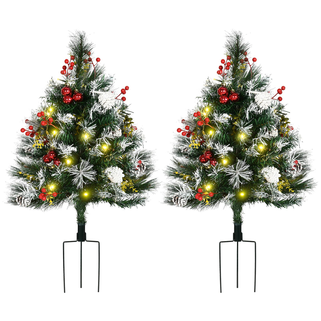 Snowberry set of two pre-lit entryway Christmas trees with snowy tips, berries, pinecones, and red ornaments