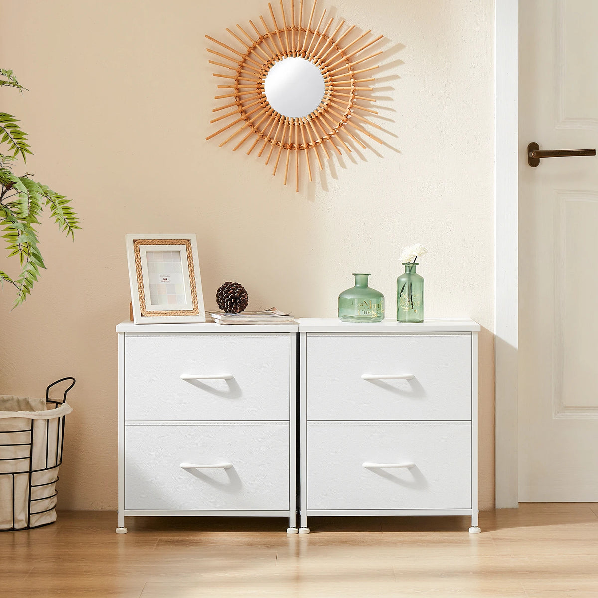 Two white Daydreamrise two-drawer nightstands side by side beneath a round sunburst mirror