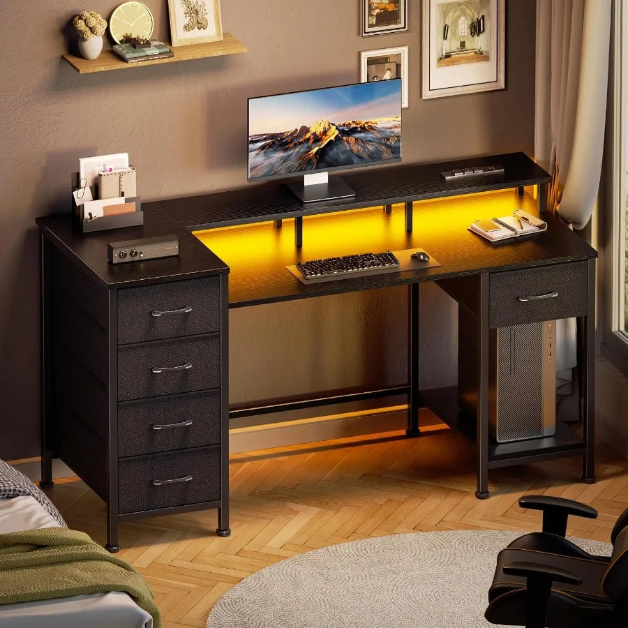 Black desk with warm yellow lighting in a home-office setting