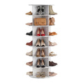 White Norfield shoe rack with seven circular tiers and divided open compartments, shown holding shoes and handbags.