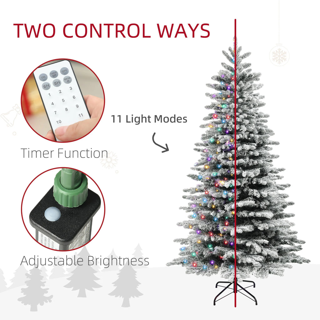 Olivehalo handheld remote and button controller beside the illuminated tree