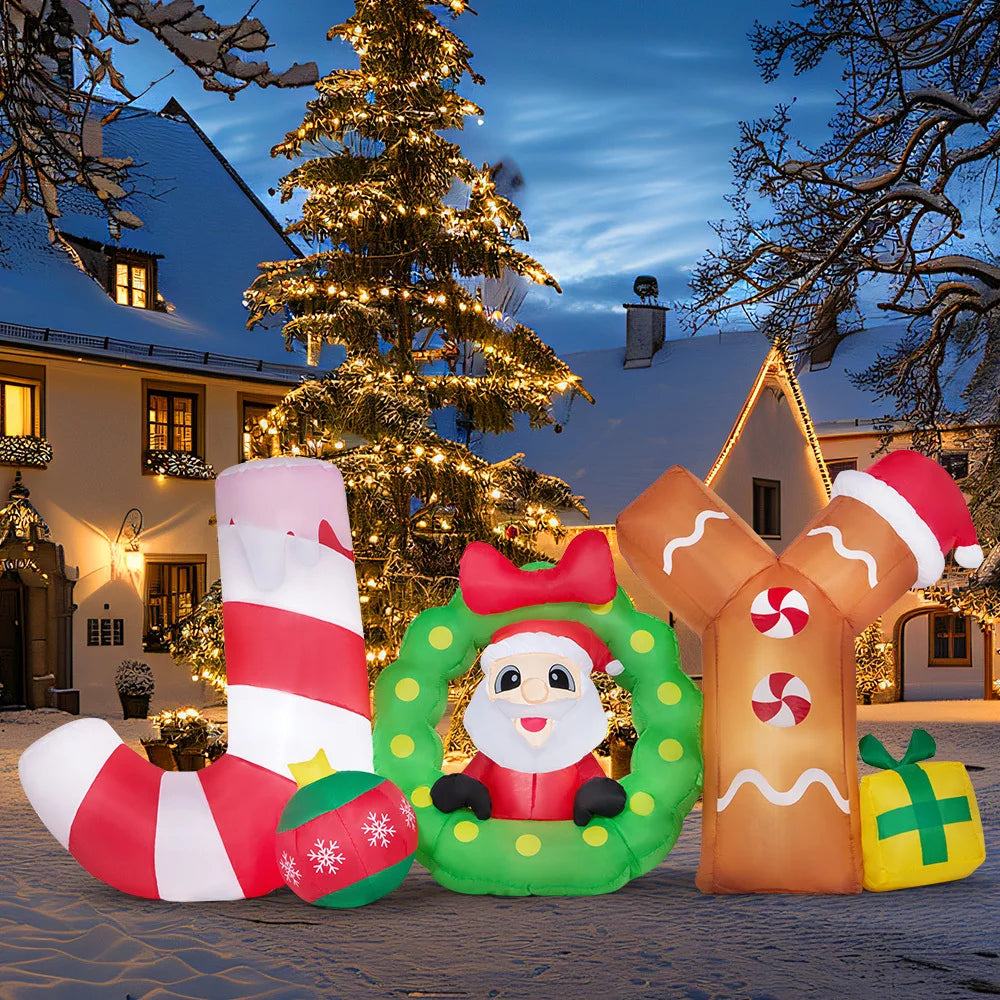 Joyribbon Santa JOY inflatable illuminated in an evening yard display.