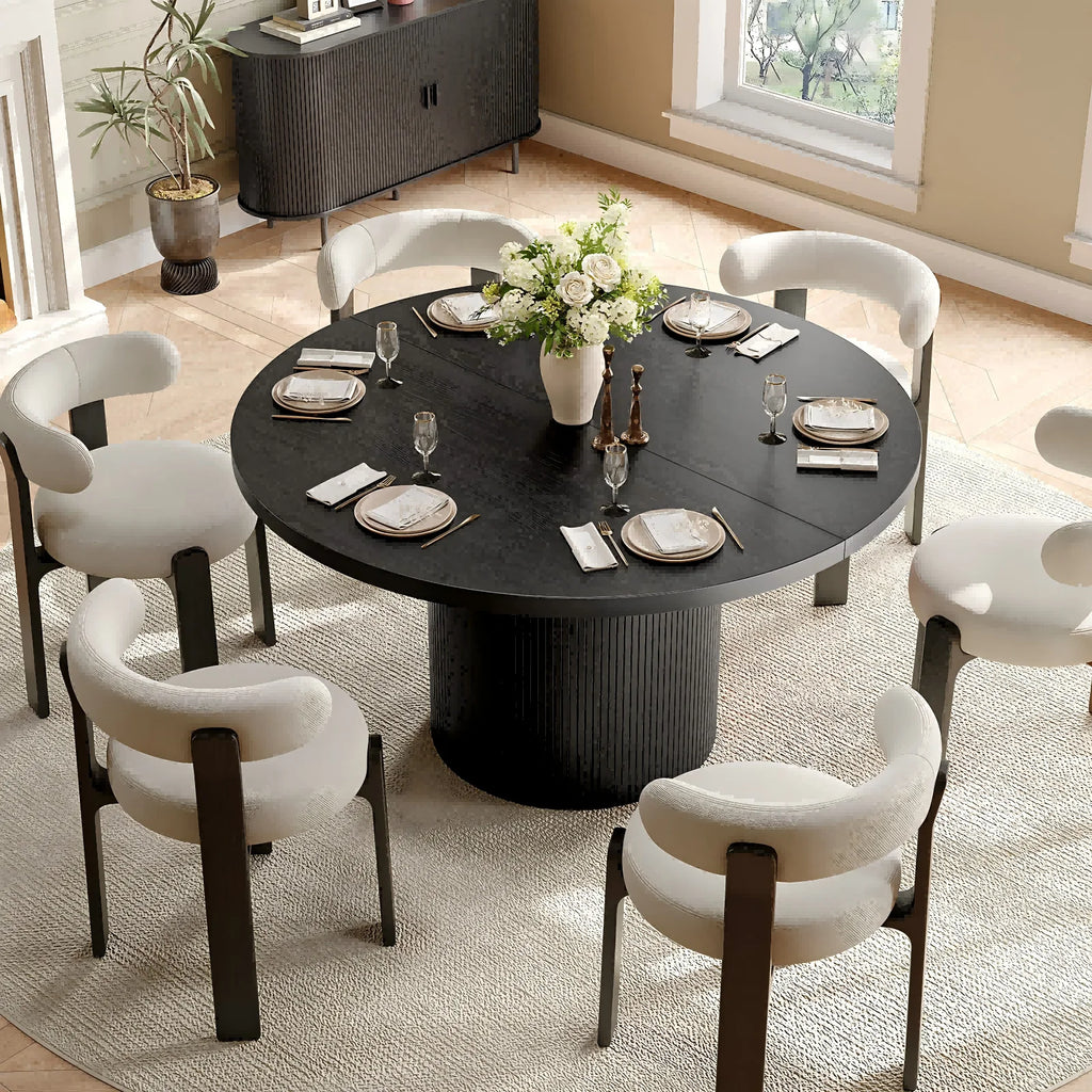 Duskwhisper black pedestal dining table in a dining room