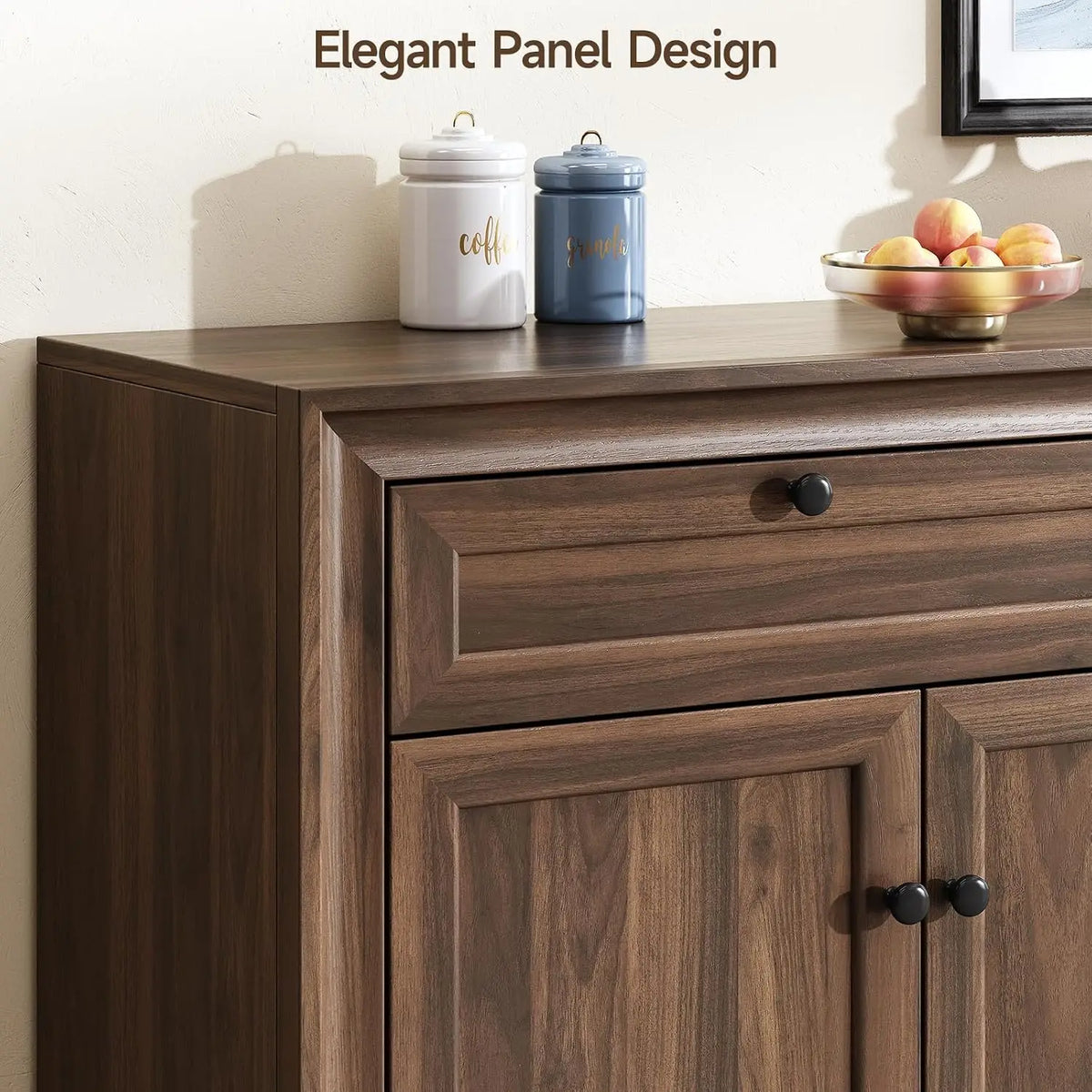 Olive Brown sideboard detail showing beveled panel trim and round black knobs.