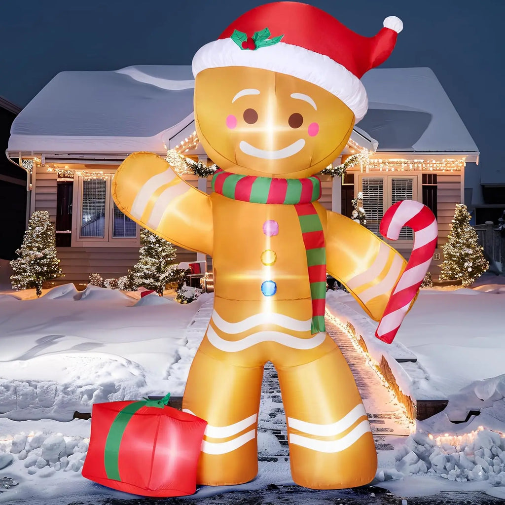 Gingerbelle illuminated gingerbread figure with three colorful buttons outside a snowy holiday home