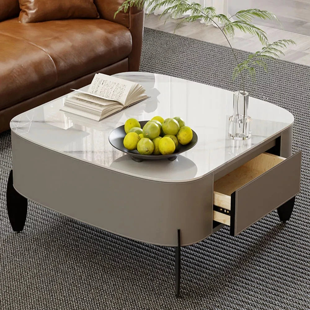 Cinderloom white sintered-stone coffee table with gray exterior and a storage drawer open