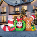 Joyribbon candy-cane, wreath and gingerbread-style JOY lettering with Santa in the center.