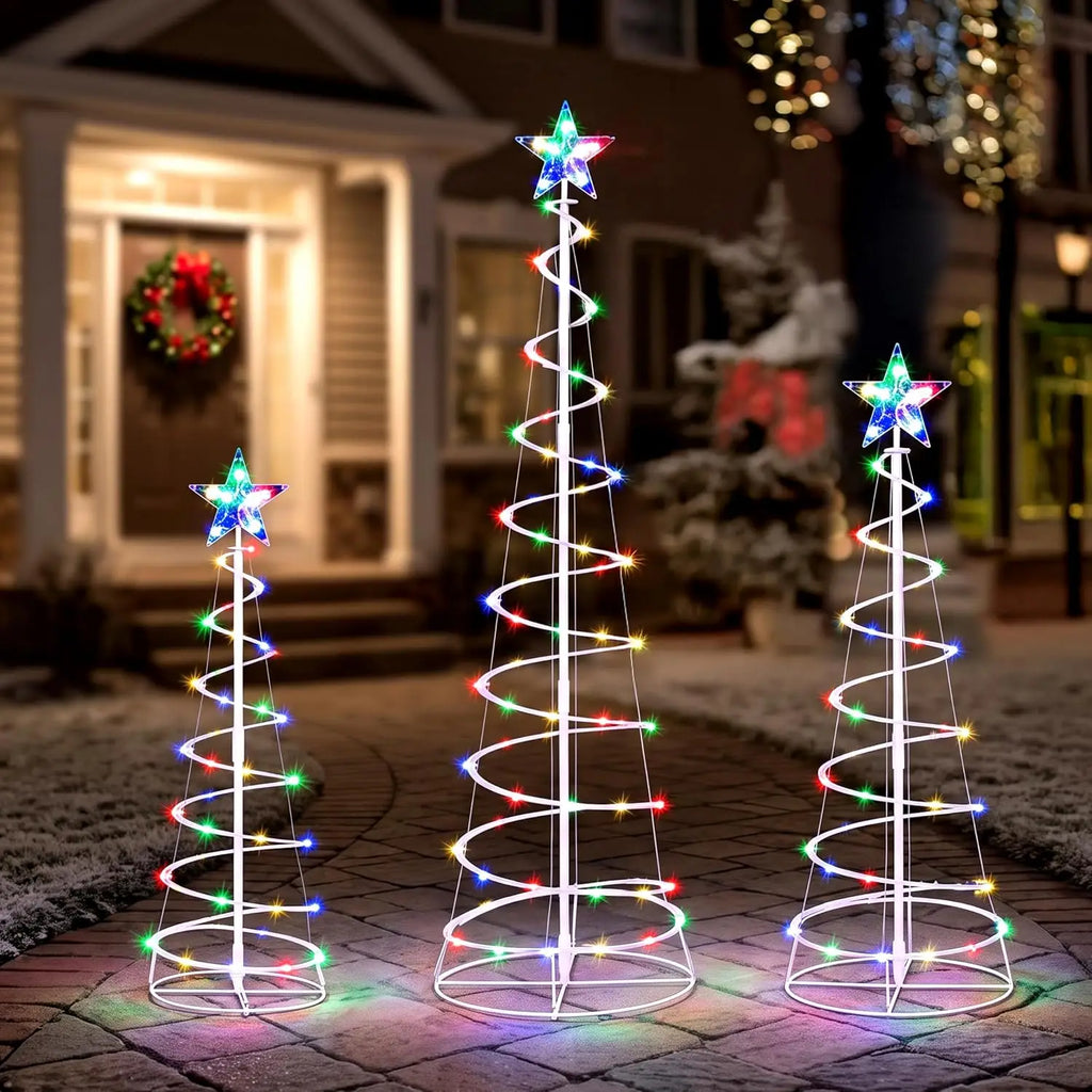Spiravelle three multicolor spiral Christmas trees with star toppers outside a decorated entryway