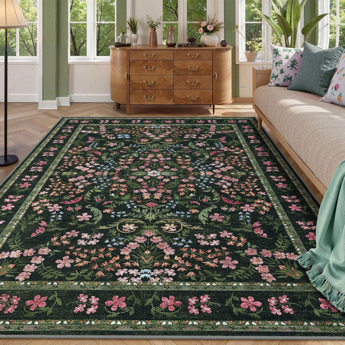 Meadowlark Green floral area rug styled in a living room