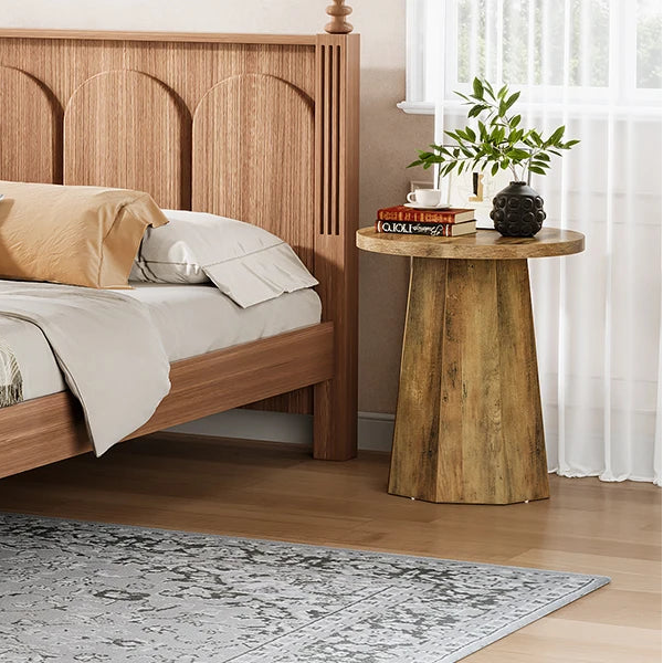 Wooden bed with bedding in a bedroom setting