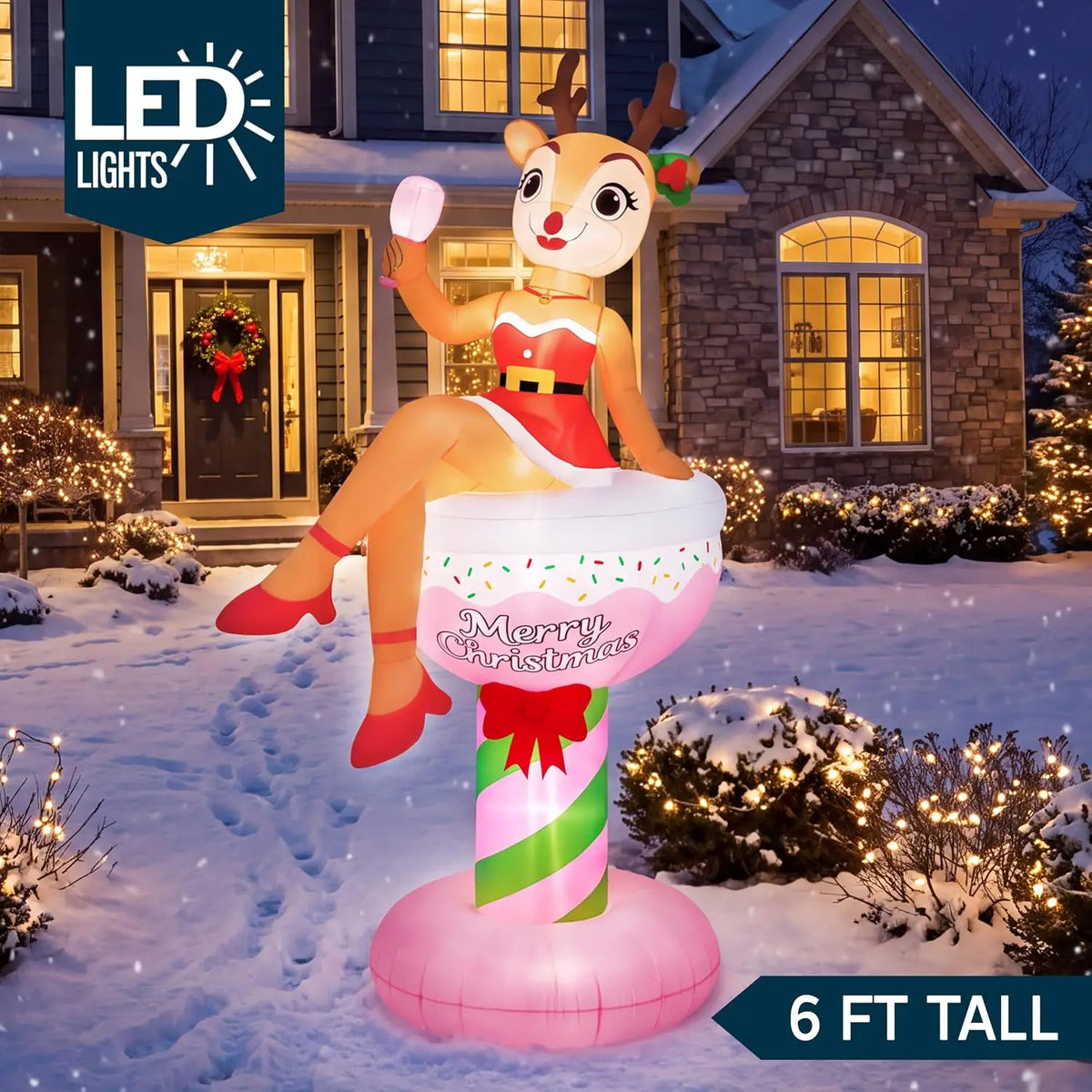Fizzbelle reindeer cocktail Christmas inflatable illuminated at night with a six-foot height label.