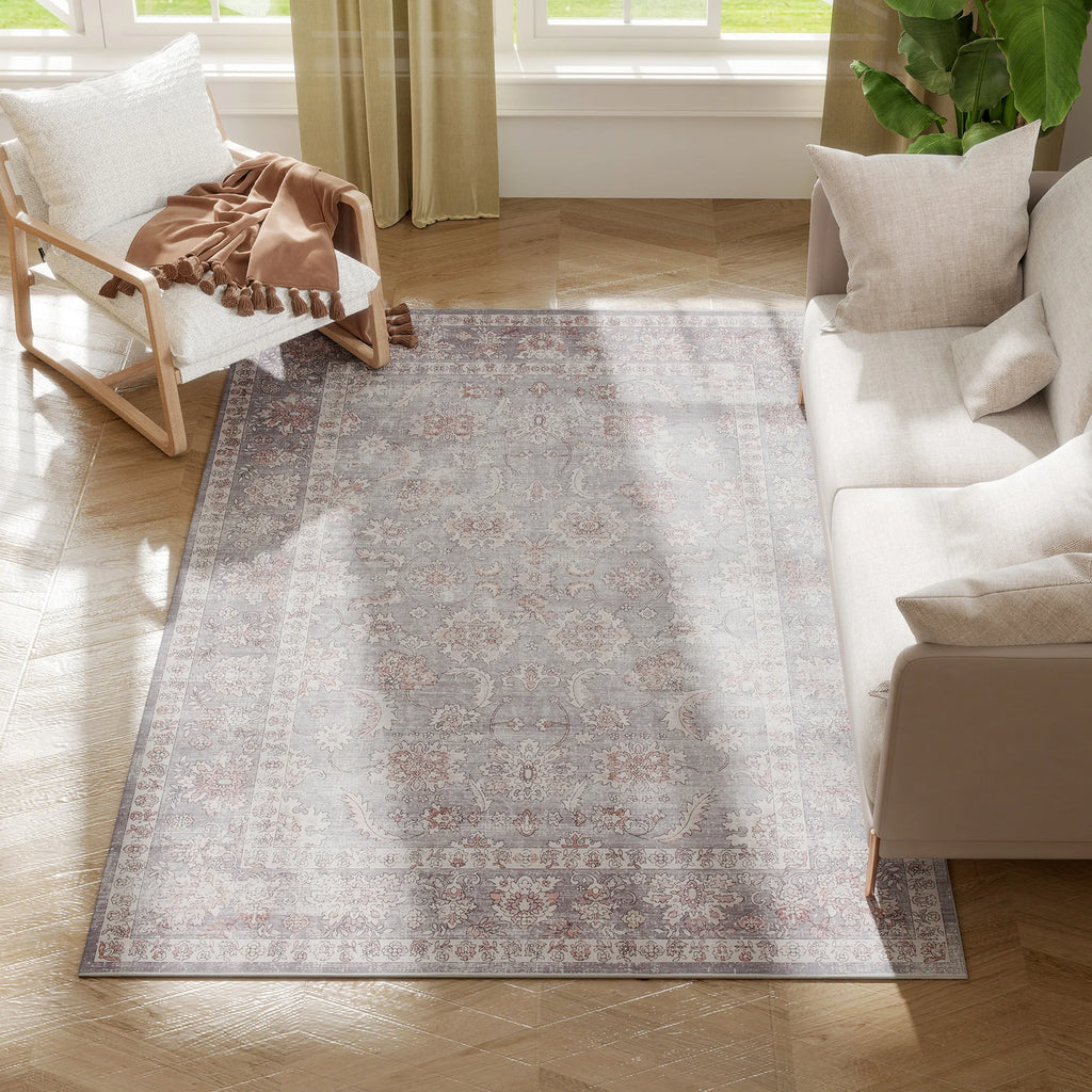 Sagerise gray-and-brown distressed floral area rug in a living room
