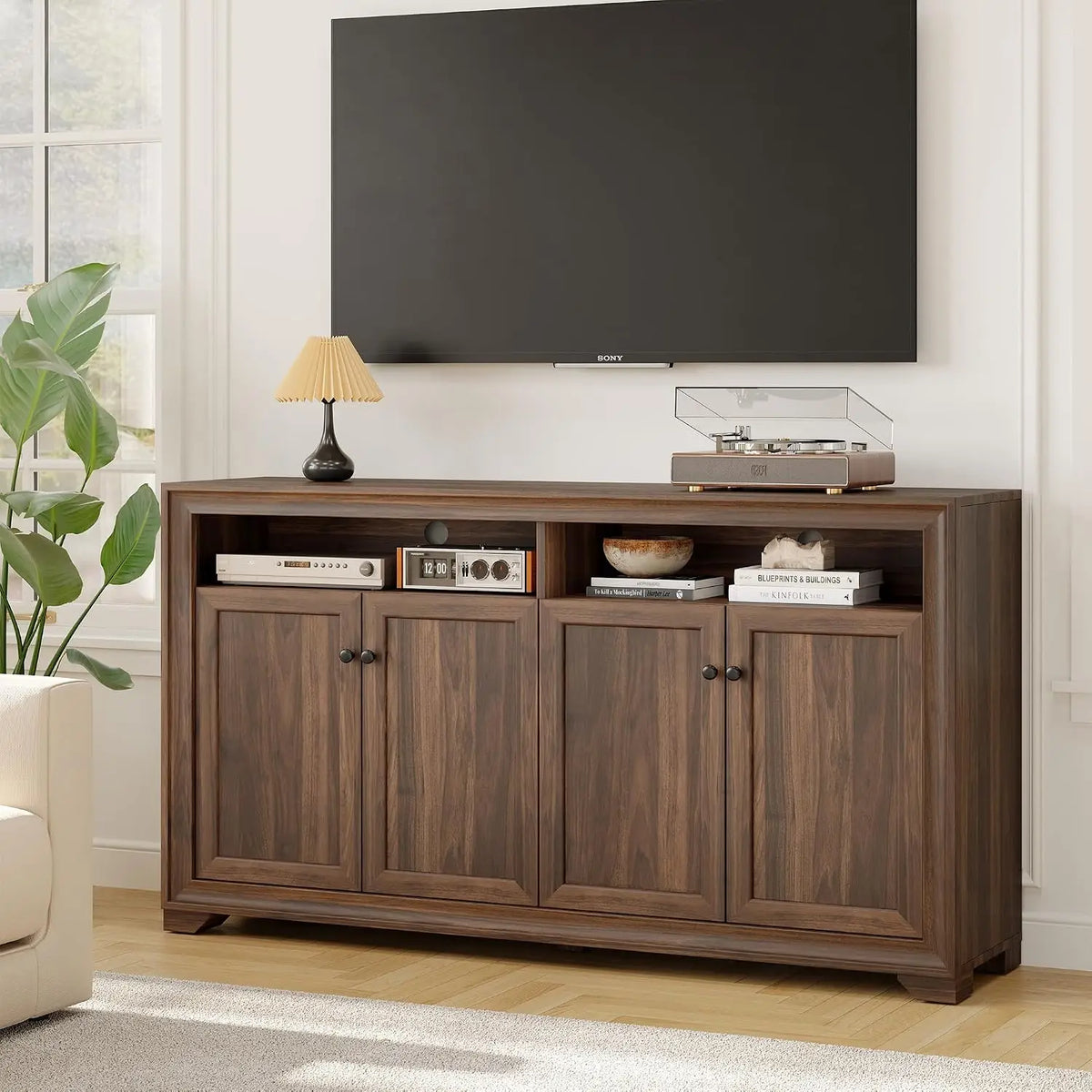Bramblenote walnut-look cabinet in a living room with open upper storage and four doors.