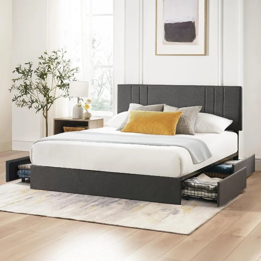 Dark gray upholstered bed with a paneled headboard and underbed wire drawers pulled open.