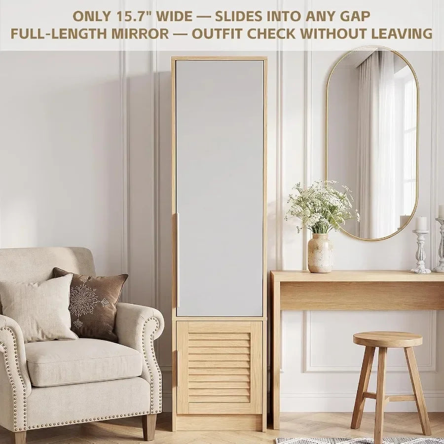 Slim mirrored wardrobe staged between an armchair and vanity