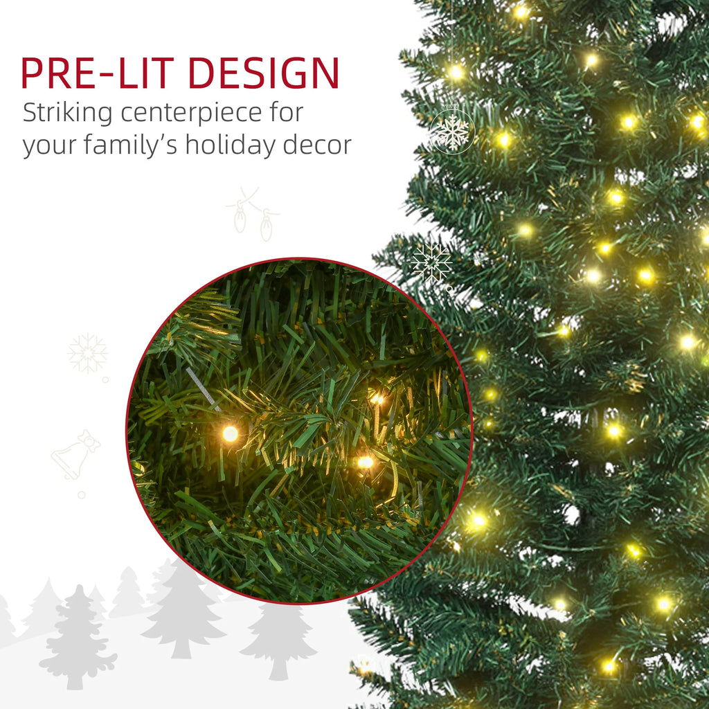 Close-up of green artificial branches and warm white lights on the Lindenlight pencil Christmas tree.