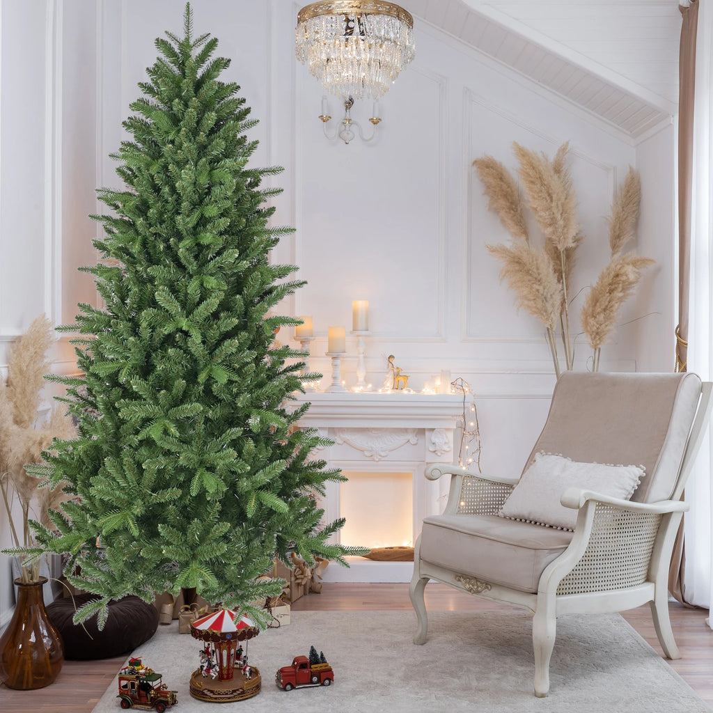 Greenhaven unlit artificial Christmas tree beside a cream accent chair
