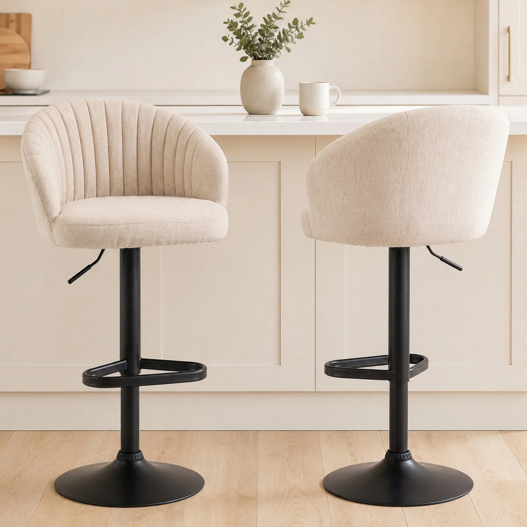 Front and rear views of Avelisse beige channelled bar stools in a kitchen