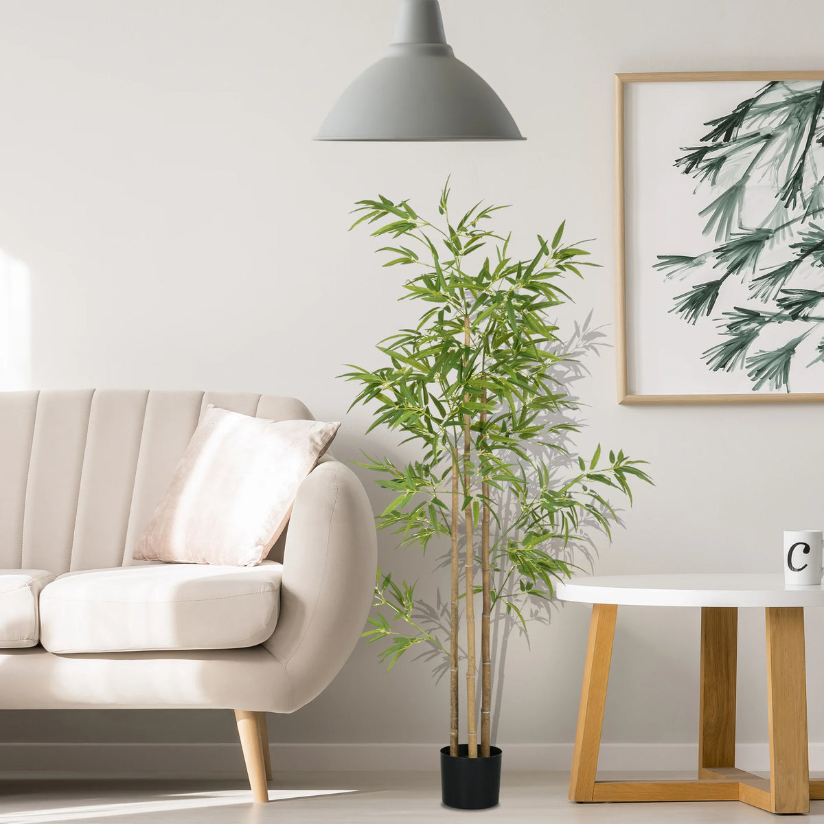 Arusha bamboo-style artificial tree beside a sofa