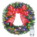 Frostbow 48-inch Christmas wreath with a dimensional red bow and multicolor LED lights